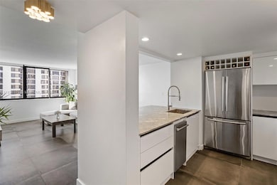 The open-concept layout seamlessly integrates with the living space, making it perfect for entertaining
