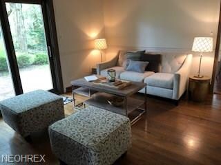 Family room with a full wall fireplace and hearth 