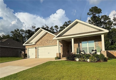View of front of property featuring brick siding, an attached garage, a porch, driveway, and board and batten siding