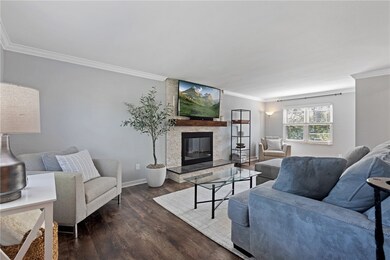 Fireplace has been revamped w/ white stone, black