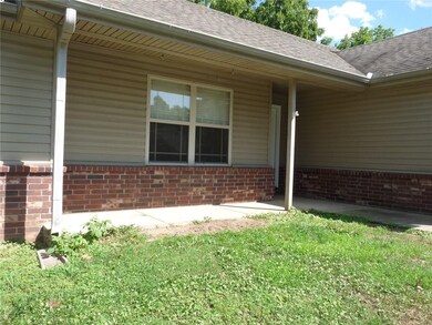 Front porch is mostly covered and waiting for your porch swing.