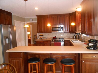 42 inch cherry cabinets, wood floors, stainless ap
