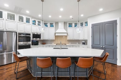 The fabulous kitchen has a Texas sized island, providing additional seating an storage.