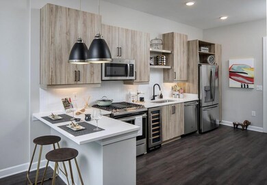 Kitchen with appliances with stainless steel finis