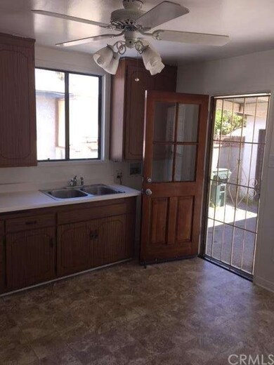 Partial Kitchen view with door to patio/garage/dri
