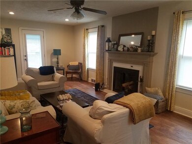 Spacious living room with wood burning fireplace, 