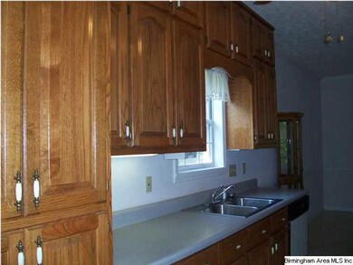 Galley kitchen opens into Dining Area.