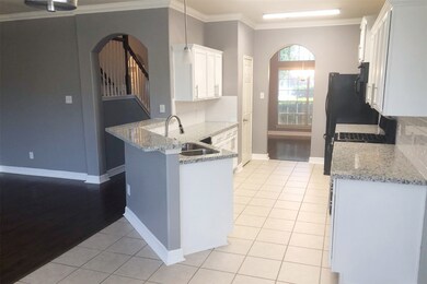 Freshly painted cabinets and new granite countertops