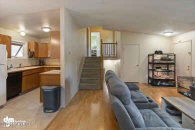 View of living area/kitchen/stairs
