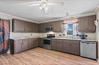 Roomy kitchen gives you plenty of cabinets and counter space to prepare the day's meals!
