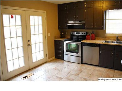 French doors leading from kitchen to concrete pait