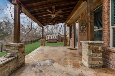 Large covered patio overlooks wooded