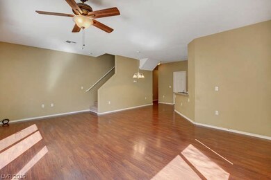 Living Room with Ceiling Fan and Slider to Backyar