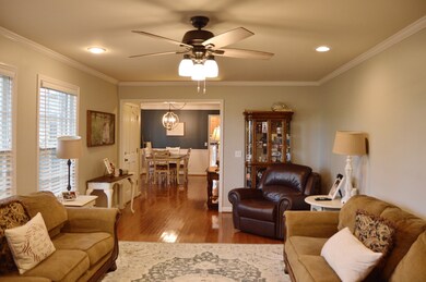 Spacious living area with hardwood flooring