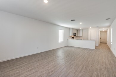 Unfurnished living room with light hardwood / wood