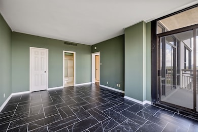 Another view of the bedroom with a walk-in closet,