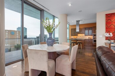 Dining area featuring floor to ceiling windows and