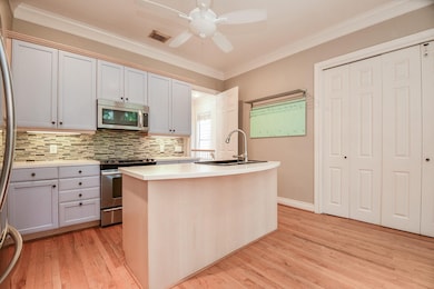 Welcome to this stylish kitchen area! It features