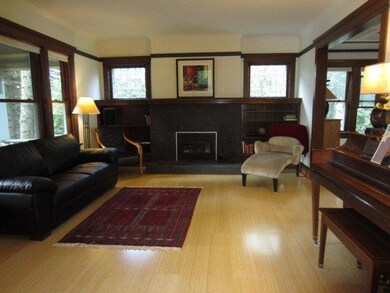 Large living room with wood burning fireplace and 