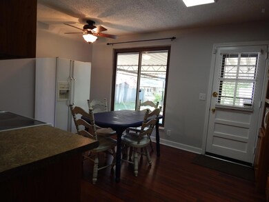 Precious eat in area with large window to enjoy the outdoor scenery.