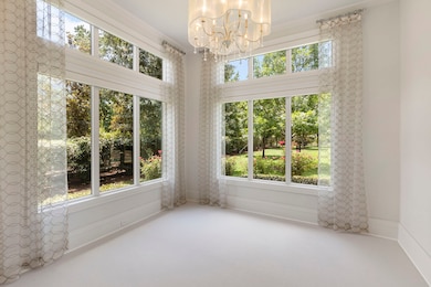 This primary bedroom's beautifully appointed sitti