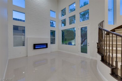 Living room with view windows towards golf course