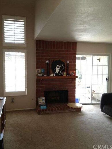 Spacious Living Room with Fireplace and Plantation