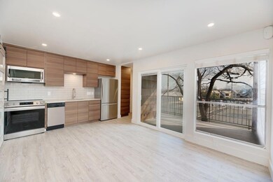 Kitchen with light countertops, appliances with s