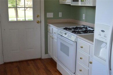 Kitchen has a nice gas stove and pantry.