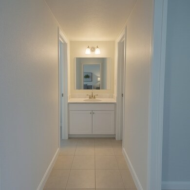 Bright vanity area with large mirror, great lighti