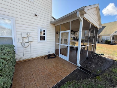 View of patio / terrace with a sunroom