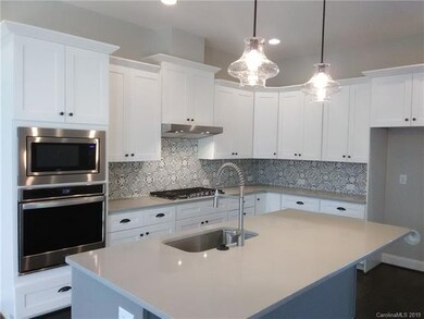 Funky backsplash and trendy pendants!