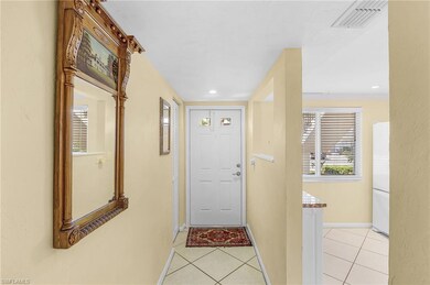 Doorway to outside featuring light tile patterned 
