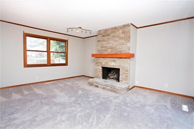Family room with stacked stone fireplace