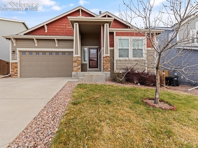 Craftsman-style home featuring concrete driveway, 