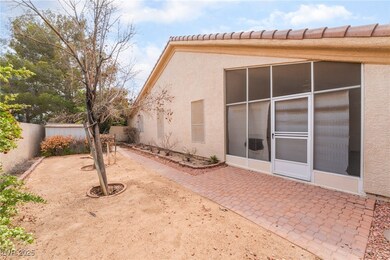 Rear view of house featuring a patio area, stucco