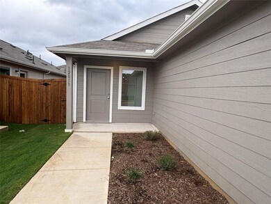 Property entrance featuring a lawn