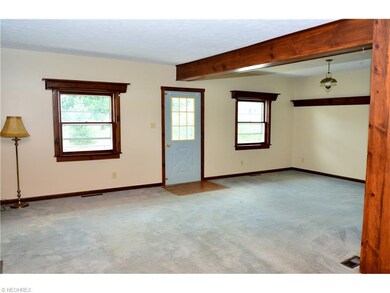 Large living room is open and bright.