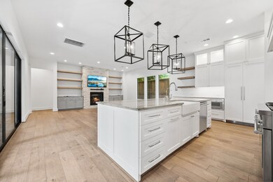 Spacious open-concept kitchen and living area feat