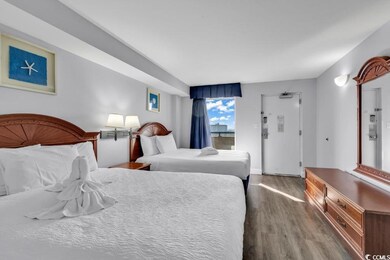 Bedroom with hardwood / wood-style floors