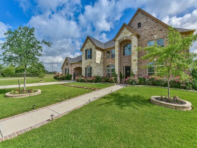 Gorgeous brick & stone elevation! Walk-path to front door!  Sprinkler system in front & back. Wolman elementary located next door to home on opposite side of walking trail!