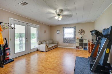 A large bonus room off the kitchen provides you with extra space for a family room, workout space, office or hobby room!