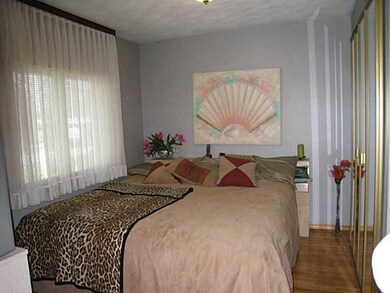 Bedroom. Beautiful hardwood floors. Large double c