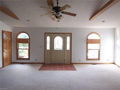 Enter from the front porch into a bright, large li