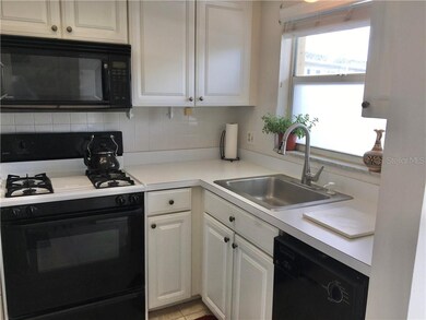KITCHEN IS TO THE RIGHT OF ENTRY AT FRONT OF CONDO