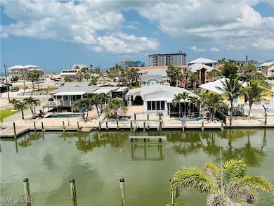 View of water feature with a dock