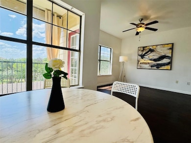 Dining room with a ceiling fan and wood finished 