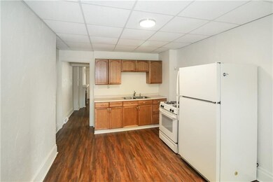 View of kitchen from laundry room.