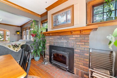 Living room with a wealth of natural light, a fire