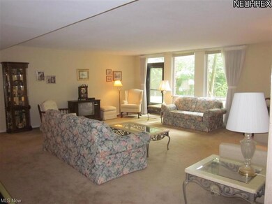 living room with door leading to private setting t